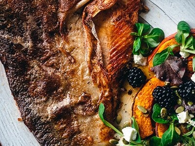 Pan-Seared Steelhead Trout with Roasted Pumpkin, Blackberries & Goat Cheese
