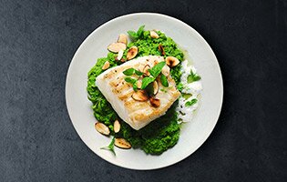 Grilled Skrei with Pea Purée, Mint Oil and Almond Foam