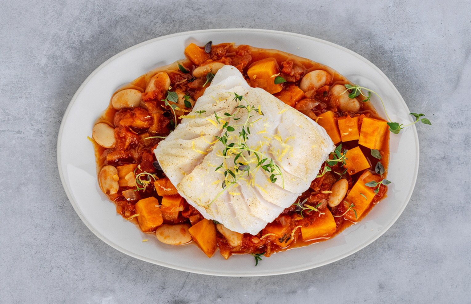 Cod sautéed with beans, sweet potato and thyme