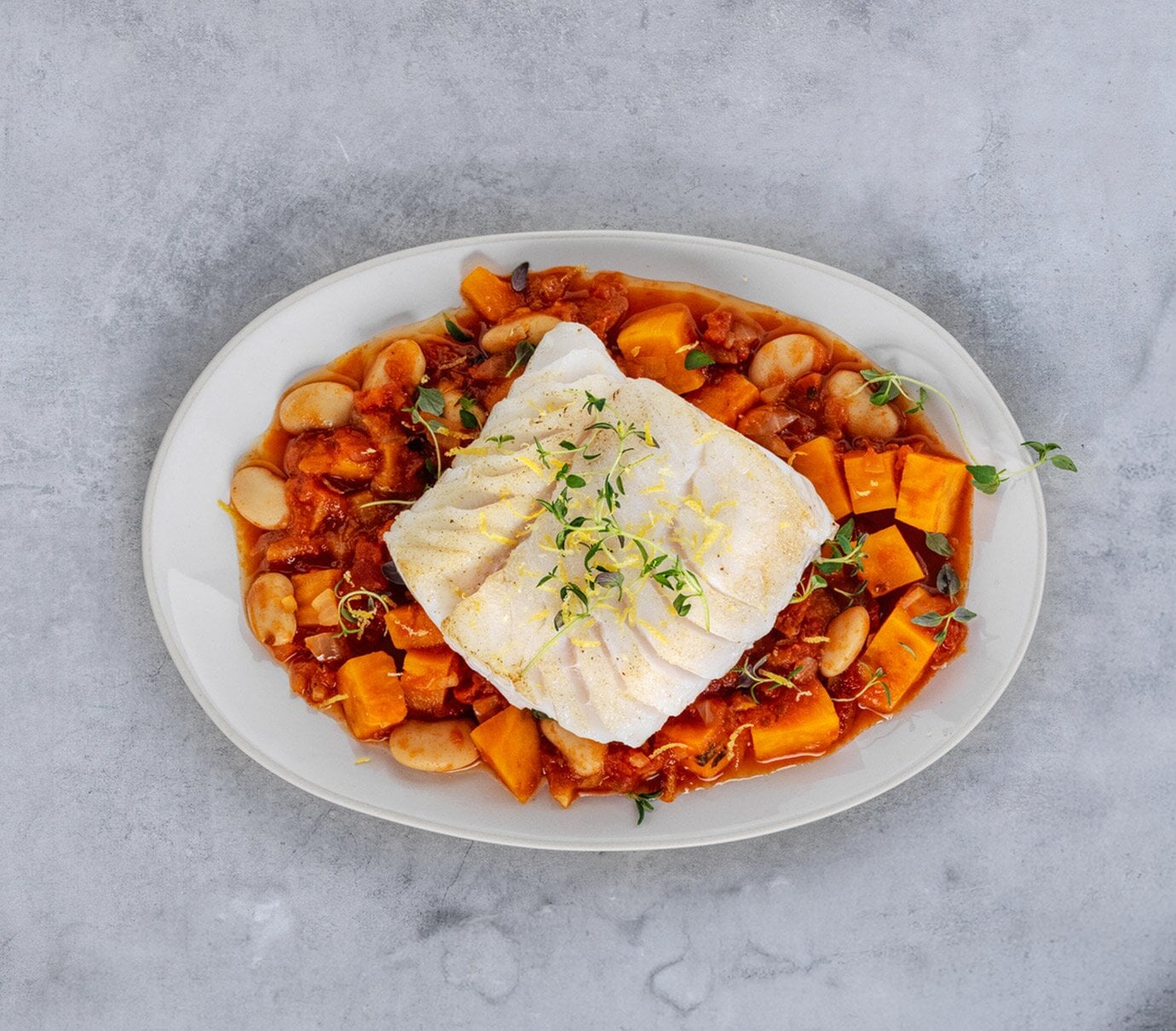Cod sautéed with beans, sweet potato and thyme