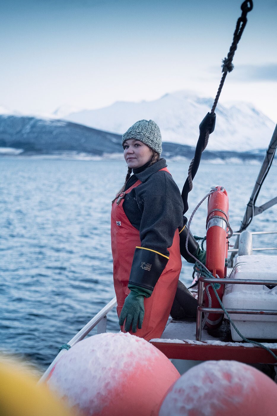 Fisherwoman looking out on a Norwegian fiord